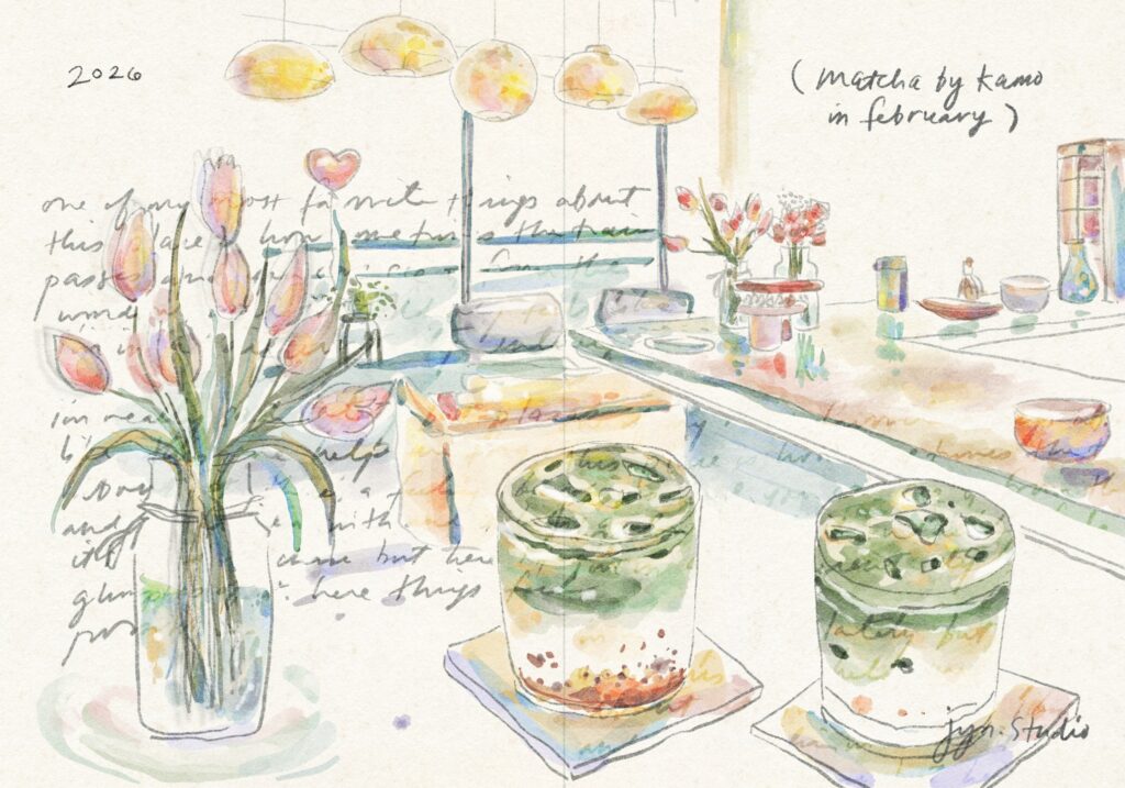 Illustrated cafe table with iced matcha drinks, pink tulips, and hanging lights.